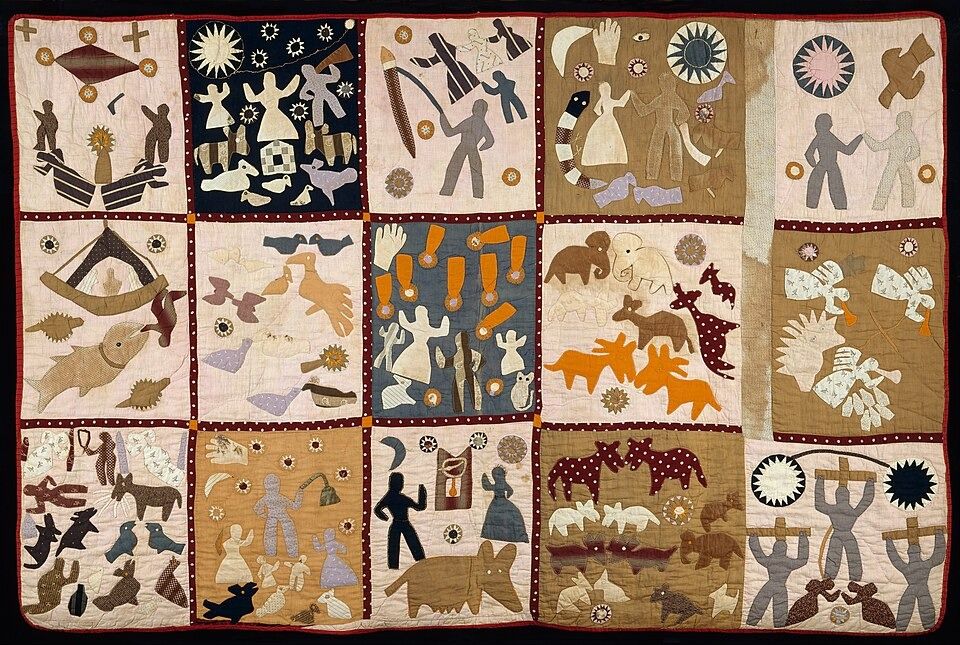 A quilt arranged in fifteen narrative panels depicts people, animals, suns, stars, and other appliquéd figures.
