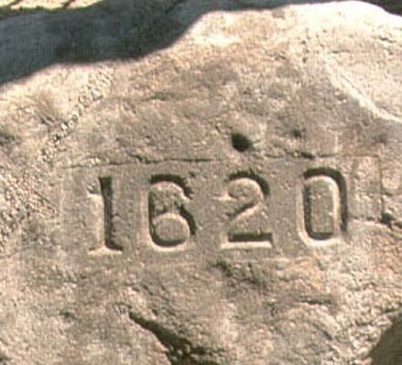 Plymouth Rock at Pilgrim Memorial State Park, marked with the year 1620.