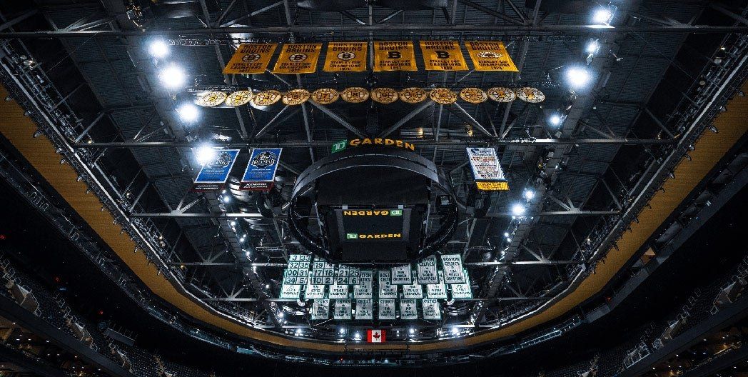 Championship banners overhead inside TD Garden, home of The Sports Museum; arena context.