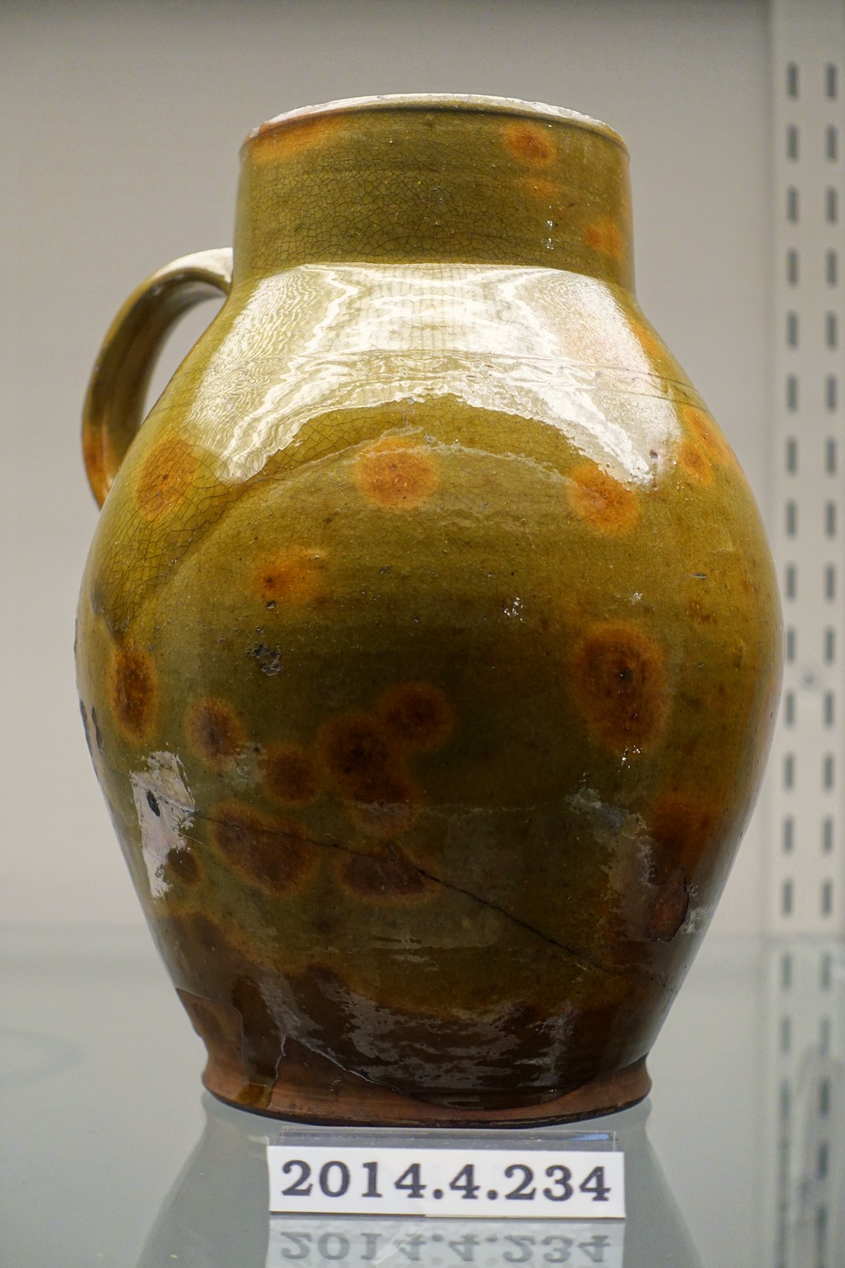 Historic redware jug from a museum collection